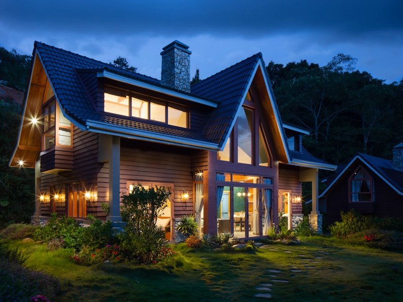 Modern detached accessory dwelling unit at dusk with warm interior light