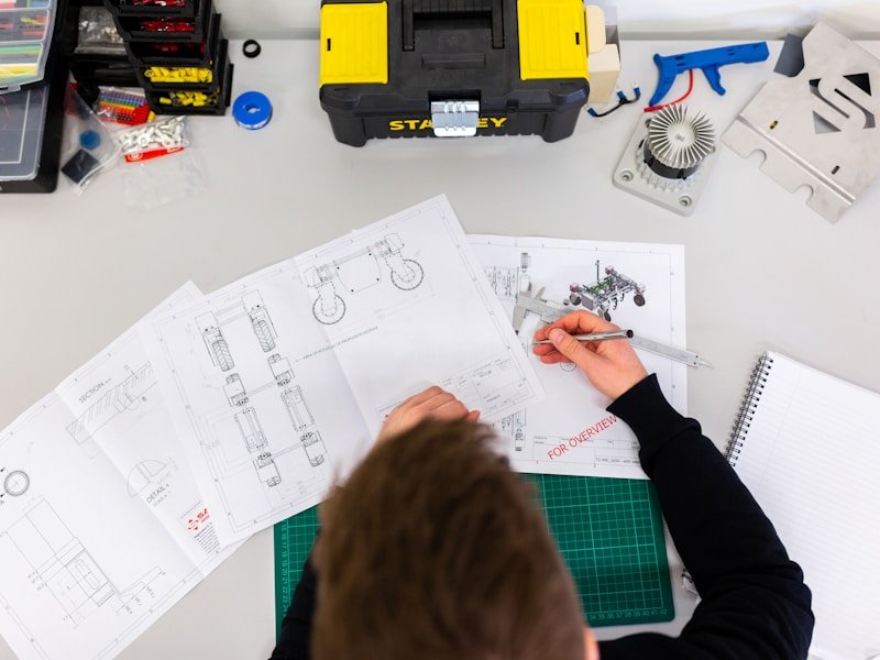 Architect reviewing structural engineering plans for foundation underpinning
